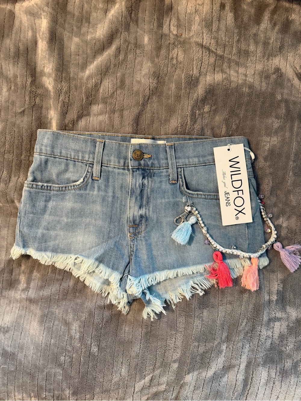 Wildfox “The Lara” Light Wash Mid Rise Cut-Off Jean Shorts w/Tassel Chain